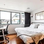 Modern Haven With Terrace View & Urban Charm