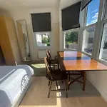 Room With Private Bathroom And Shared Kitchen